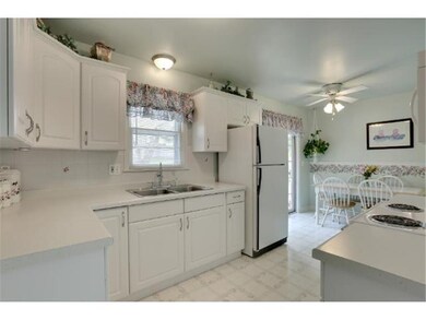 The kitchen is open to the dining area, and walks 