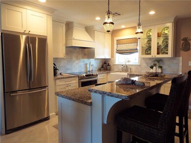 SNACK BAR  AND CENTER ISLAND - WINDOW IN KITCHEN -