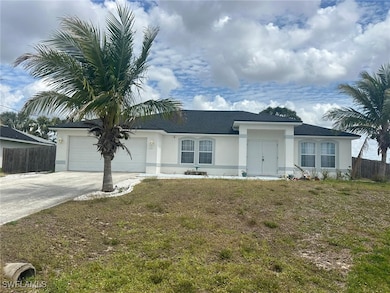 Ranch-style house featuring stucco siding, drivewa