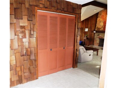 Foyer has cedar shakes, large closet and ceramic t