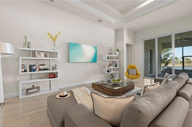 Living area featuring crown molding, recessed ligh