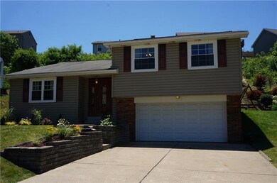 Colors of brick, siding, and shutters add to the c