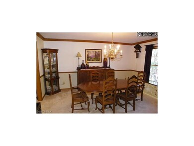 Formal dining room w/ chair rail & crown molding