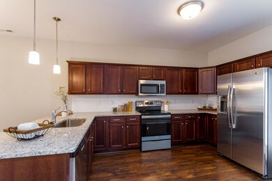 Kitchen with Granite, Tile Backsplash and Full Stainless Steel Appliance Package