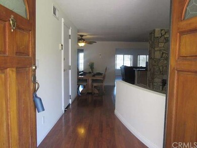 Entry with  rich hardwood flooring
