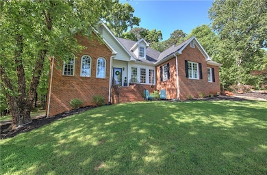 View of front of home with brick siding and a fron