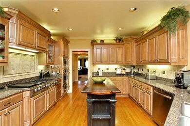 Granite counter tops, custom ceramic tile back splash, Viking oven, Viking microwave, Viking warming drawer, Jenn Air gas cooktop, & an Insta-Hot water dispenser make this a must-have kitchen!