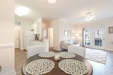 Dining area with baseboards, light wood-style floo
