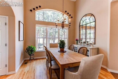 Dining room features 15' ceilings and views! Hardw