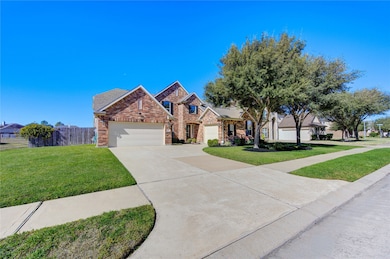House has 3 car garage and wide driveway with extra parking.