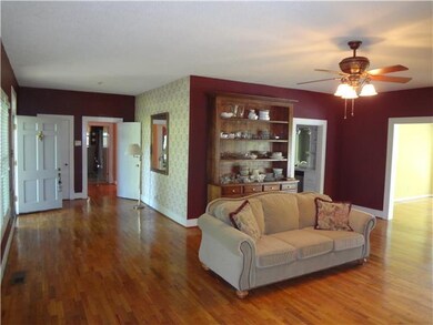 Other side of Living Room also show the Foyer and the China Hutch (Bookcase).