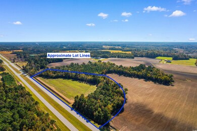Birds eye view of property featuring a rural view