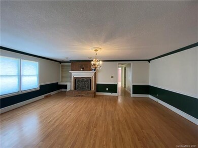 GREAT ROOM WITH BUILT-INS AND FIREPLACE