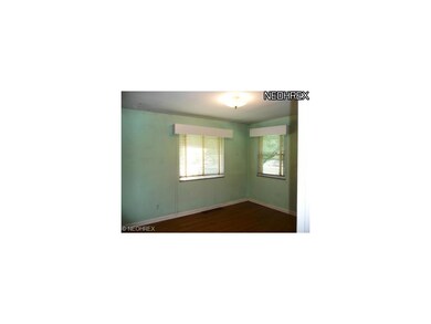 First floor bedroom with hardwood floors and ample