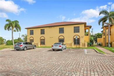 View of property with uncovered parking