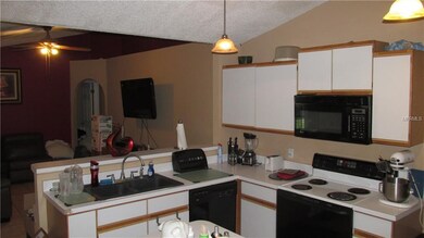 Kitchen with Breakfast Bar, overlooking Family Room