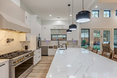 This kitchen features a modern design with 3-Monog