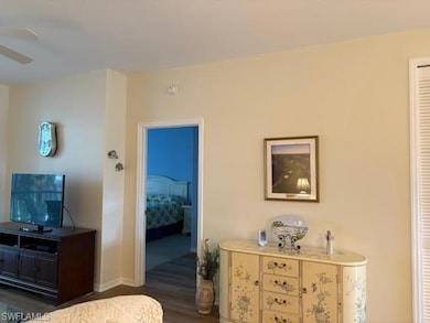 Bedroom featuring dark wood-style floors and ceiling fan