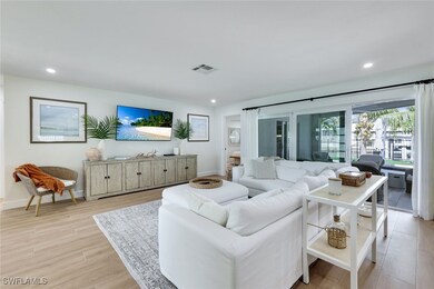 Living room with baseboards, visible vents, light