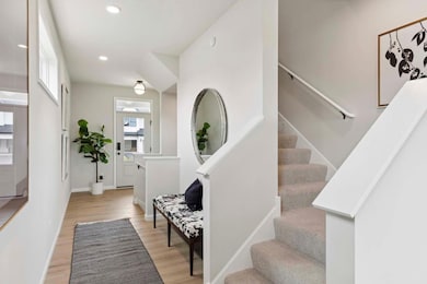 Beautiful foyer with turned staircase to 2nd floor 4 bedrooms and loft. Photos taken from model of similar floor plan. Photos may not depict actual home plan configuration. Features/materials/finishes shown contain options not included.