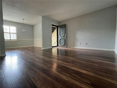 Living Room showing front door and Dining Room.