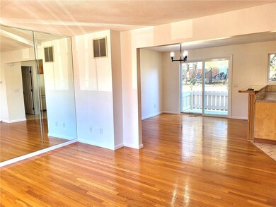 View from the front door. Open living room dining