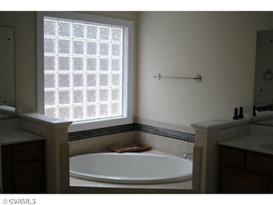 Master Bath - two sinks, corner tub, tile shower