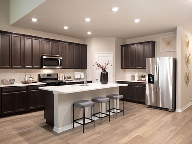 Kitchen with appliances with stainless steel fini