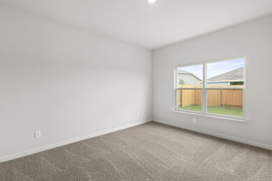 Carpeted empty room with baseboards