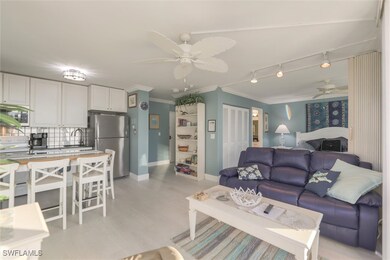 Living room with ceiling fan, rail lighting, sink,