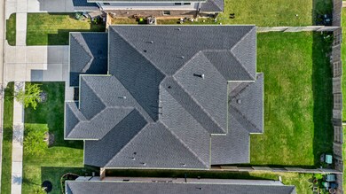 Top-down aerial view reveals the expansive rooflin