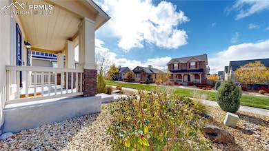 Front entrance of the home with green space and wa
