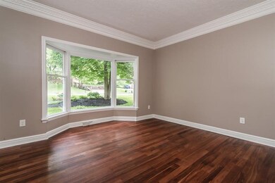Formal Living features new hardwood floors, crown 
