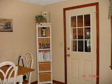 Kitchen. Entry door into kitchen from 3 season bre