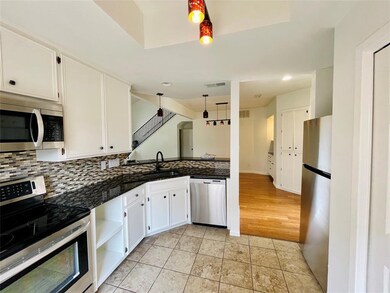 Kitchen featuring light tile patterned floors, ha