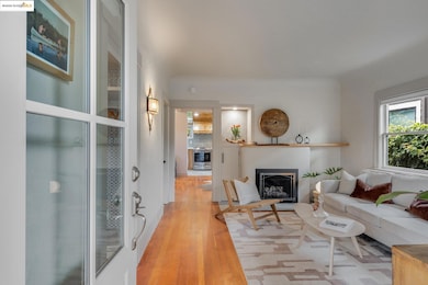 Living area featuring wood-type flooring and a fireplace