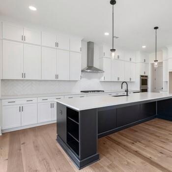 The gourmet kitchen makes a statement with it’s premium finishes