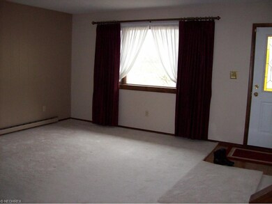 View of the Living Room.  Parquet flooring in foye