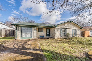 Ranch-style house with a front yard