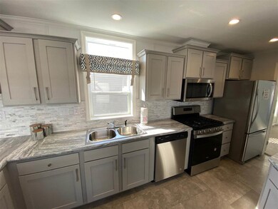 Staged furniture not included as part of sale. Pic