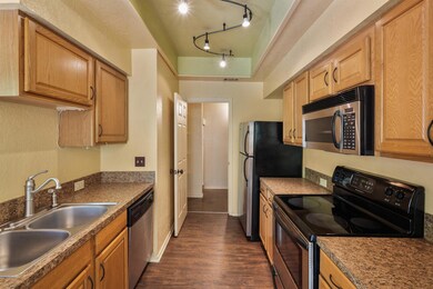 Kitchen with a sink, stainless steel appliances, 