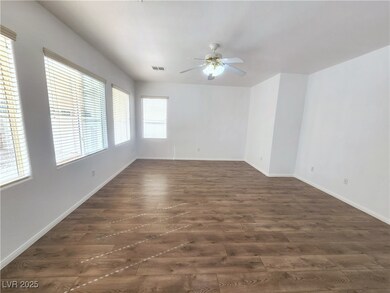 Spare room featuring visible vents, ceiling fan, b