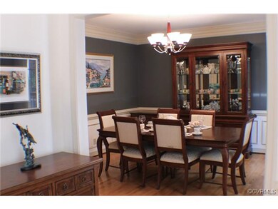The dining room has molding details and is located
