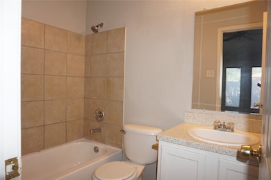 Bathroom featuring shower / tub combination and vanity