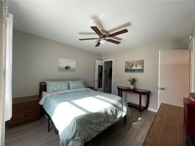 Bedroom with light wood-style floors and a ceilin