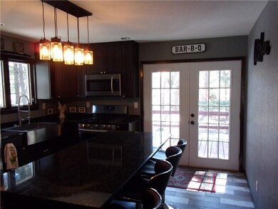 French-style doors open to the back yard and deck