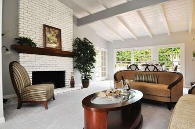 Living Room w/ Fireplace and vaulted ceilings
