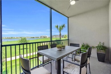 Sunroom / solarium with a water view and ceiling f