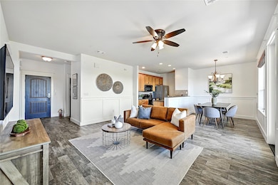 Living room with recessed lighting, ceiling fan w