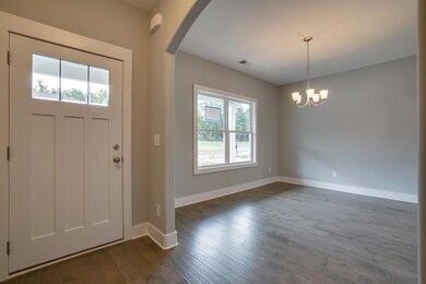 Walk through the front door and immediately to your left is  formal dining/ flex room